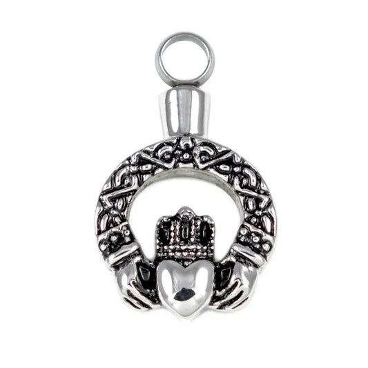 Silver Claddagh pendant on a white background