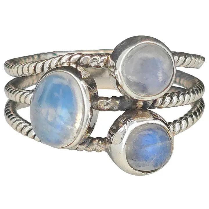 Three silver rings with moonstone stones on a white background