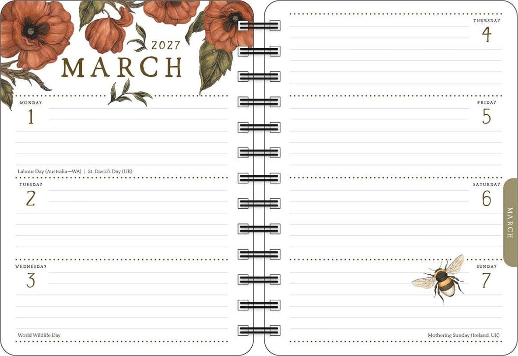 A spiral-bound monthly planner spread for March 2027, featuring orange floral illustrations at the top left, lined daily writing slots, and a small bee graphic near the bottom right.