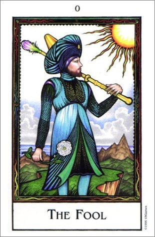 A tarot card titled 'THE FOOL' showing a stylized figure in a blue and green robe with a yellow staff, standing in a landscape under a bright sun. The card has a white border at the bottom with the title printed in black.