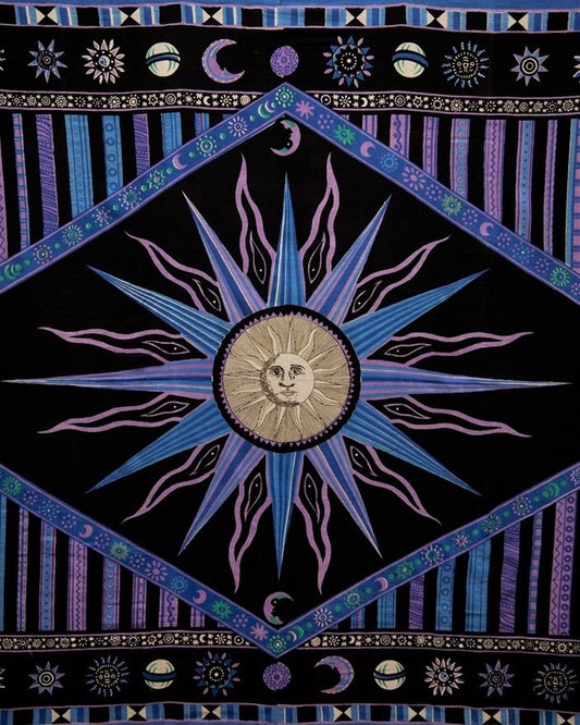 Decorative tapestry with celestial designs, including a sun and moon emblem, on a black background.