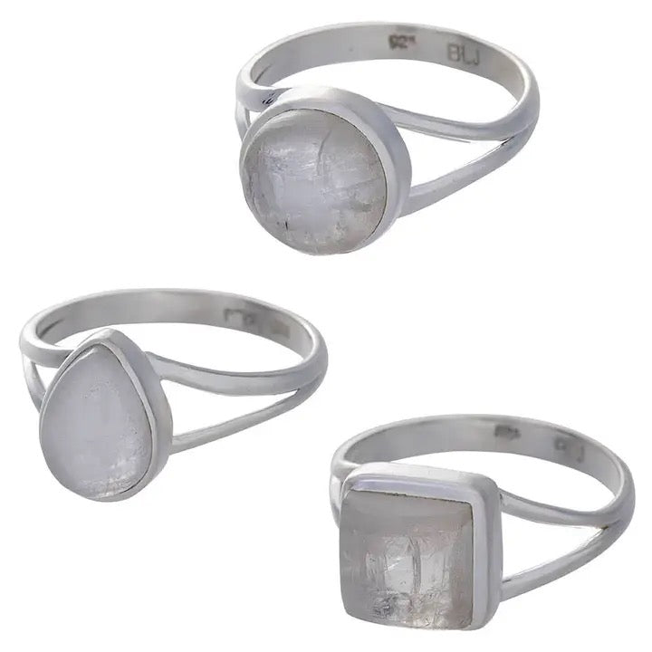 Three silver rings with different shaped gemstones on a white background