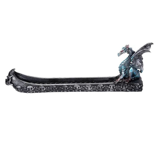 A gothic-style dragon figurine shaped like a long, low tray or boat, with a detailed blue and red dragon perched on the right end, set against a plain white background.
