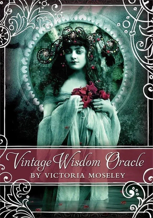 Deck cover of 'Vintage Wisdom Oracle' by Victoria Moseley with a woman holding flowers and decorative elements.