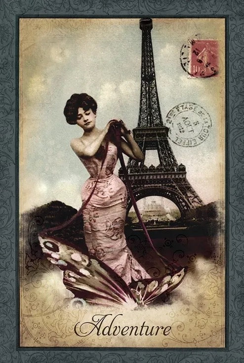 Vintage-style card with a woman in a dress, Eiffel Tower, and 'Adventure' text.