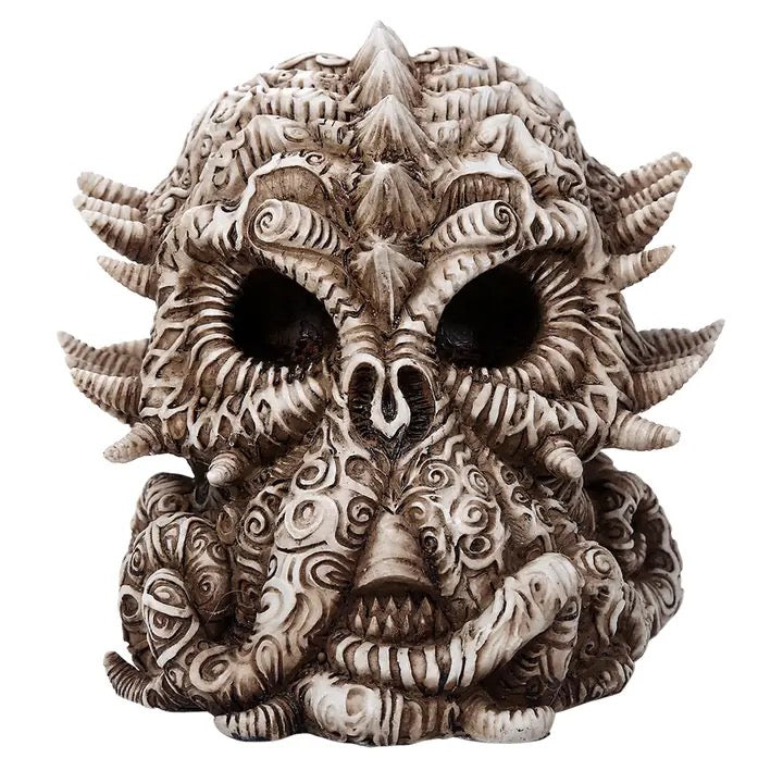 Decorative skull with intricate designs on a white background