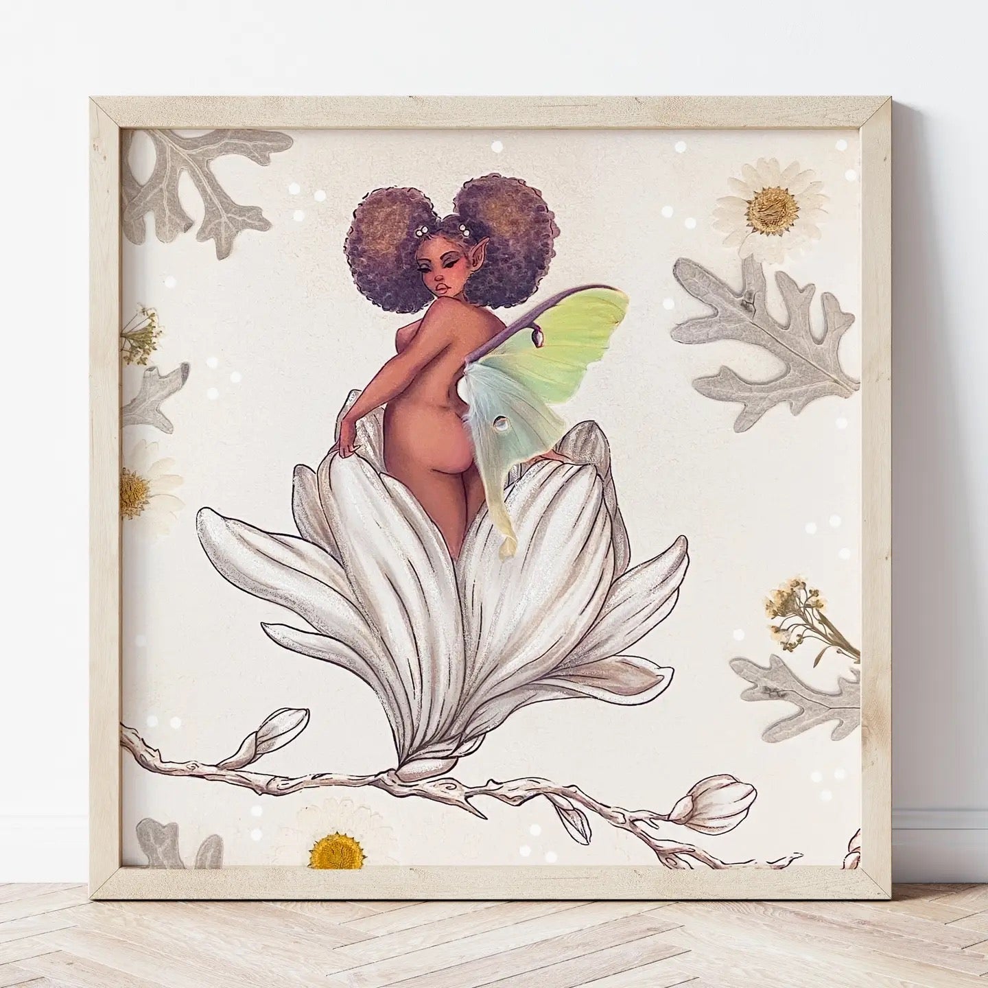 Framed artwork of a fairy sitting on a flower with a neutral background