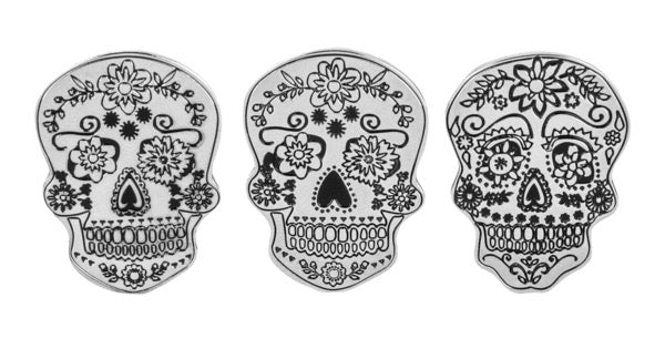 Back Three decorative skull designs with floral patterns on a white background