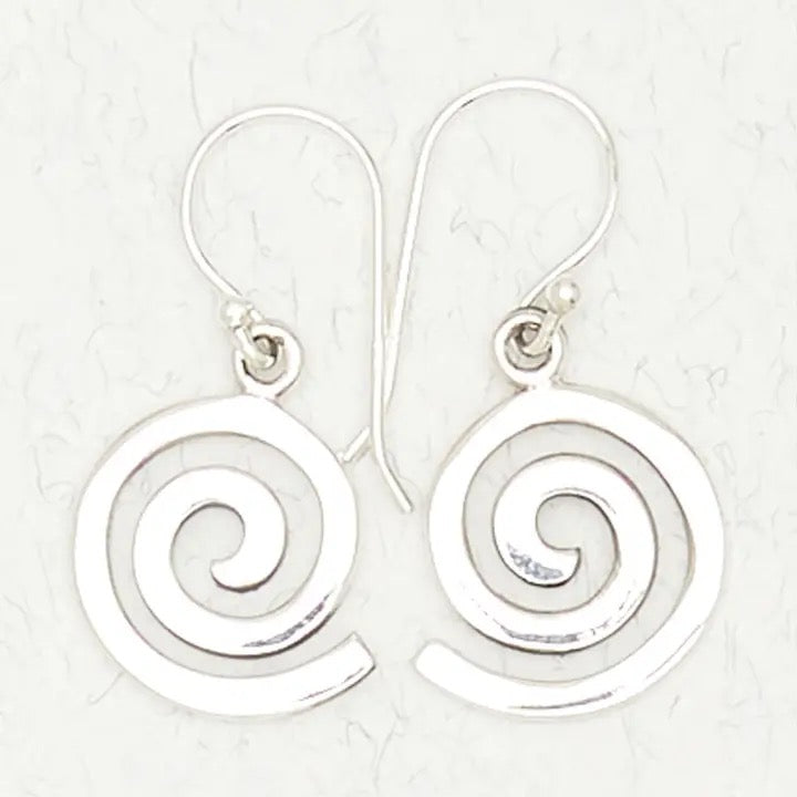 Silver spiral earrings on a light gray background