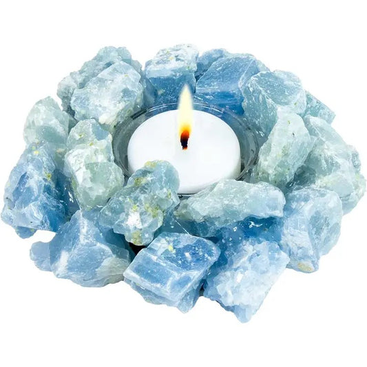 Tealight candle holder made of blue crystal-like stones on a white background