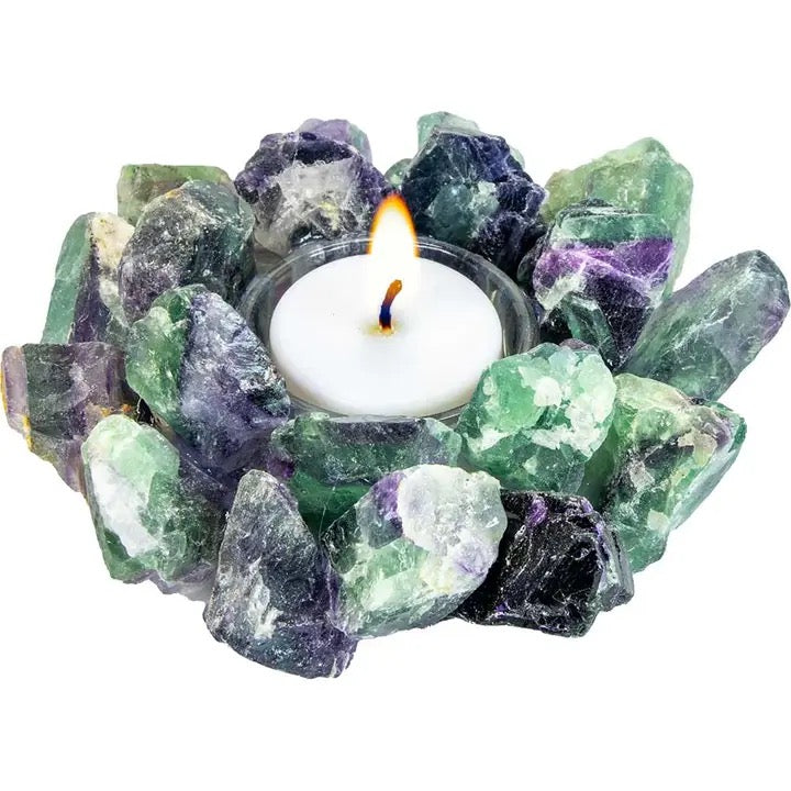 Tealight candle holder made of natural green and purple crystals on a white background
