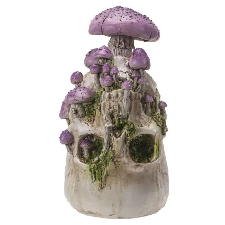 Decorative mushroom sculpture with purple caps on a white background