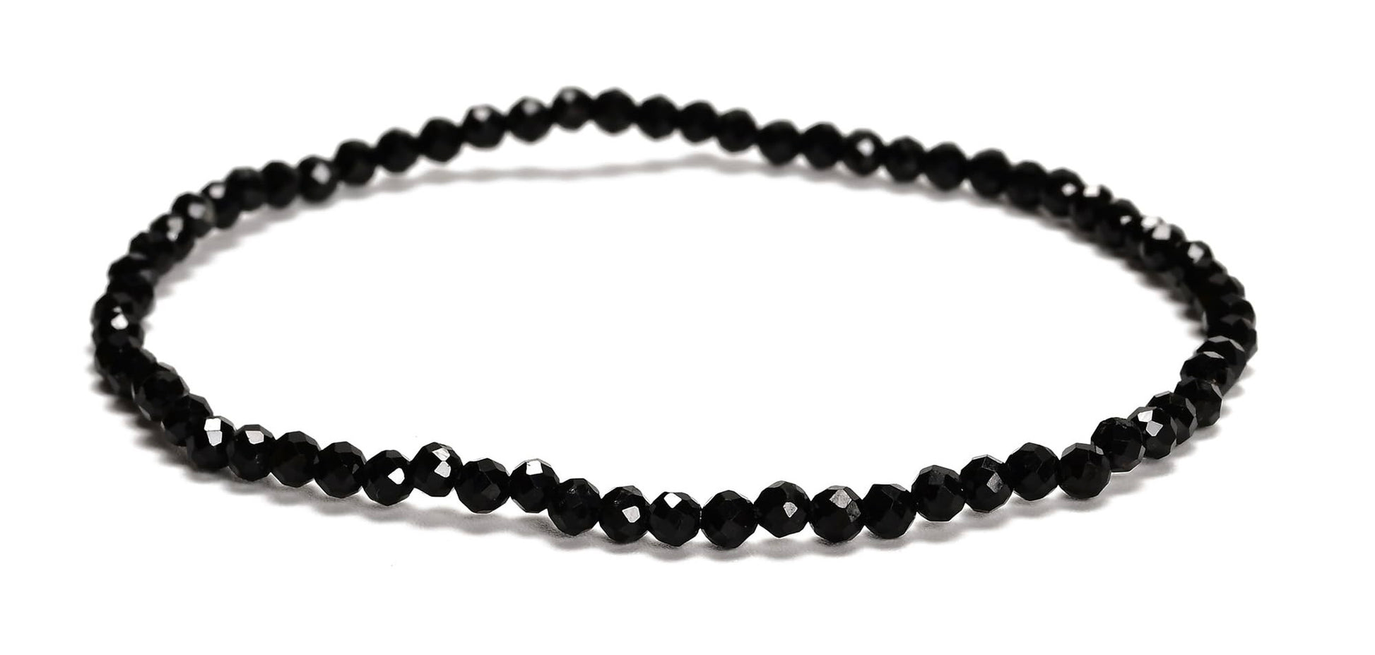 Black beaded necklace on a white background