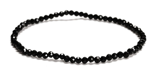 Black beaded necklace on a white background