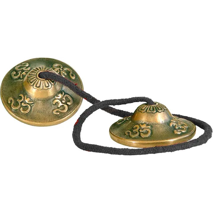 Tingshas OM Embossed on a white background