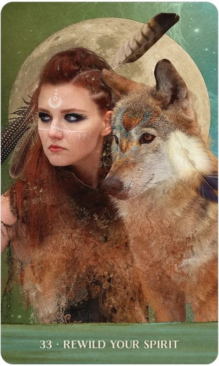 Card with a woman and wolf in front of a moon, featuring text 'Rewild Your Spirit'.