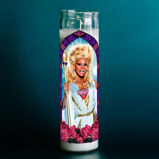 Candle with a portrait of a person with blonde hair and a purple border on a teal background