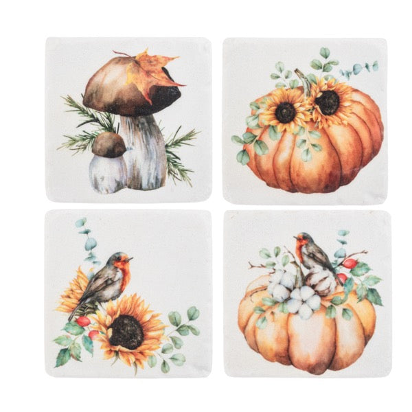 Set of four coasters with autumn-themed designs including pumpkins, mushrooms, and sunflowers.