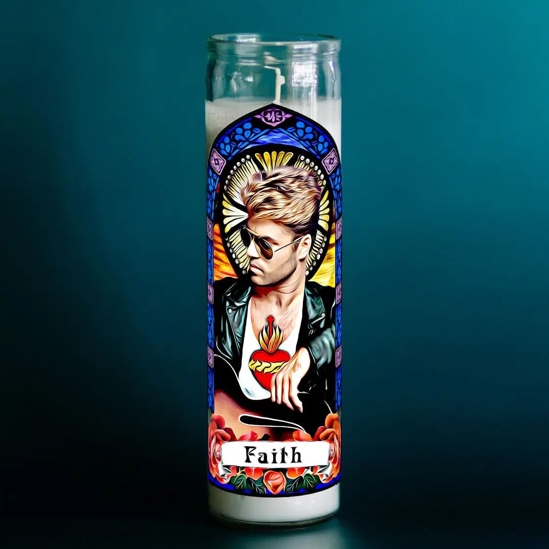 Candle with a colorful design featuring a face and the word 'Faith' on a dark background