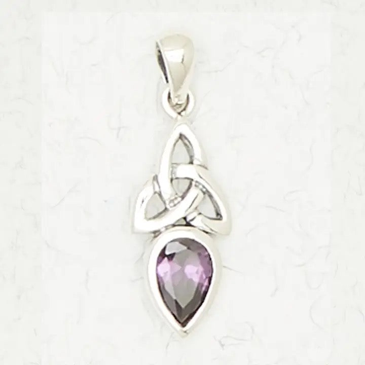 Silver pendant with a purple gemstone on a white background