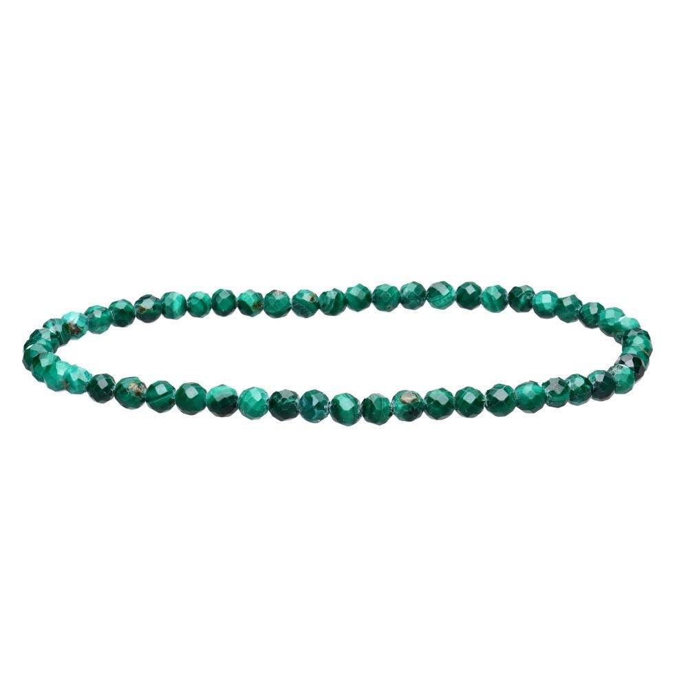 Green beaded bracelet on a white background