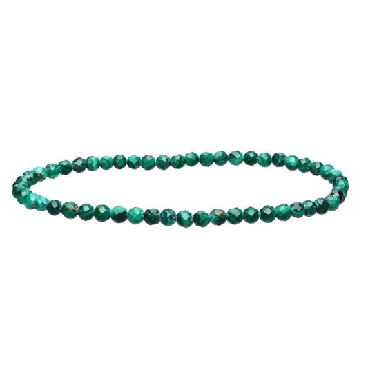 Green beaded bracelet on a white background