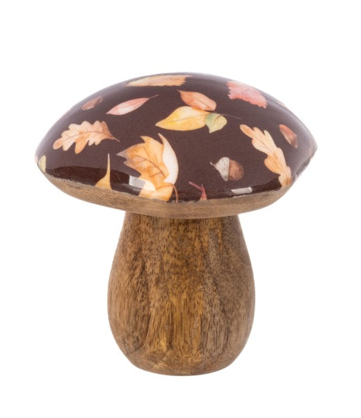 Decorative mushroom with leaf pattern on cap and wooden stem on a white background