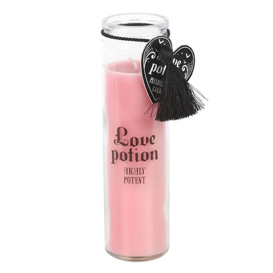 Pink candle labeled 'Love potion Highly Potent' with decorative hearts on a white background