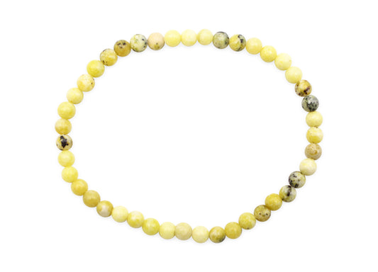 Yellow beaded bracelet on a white background
