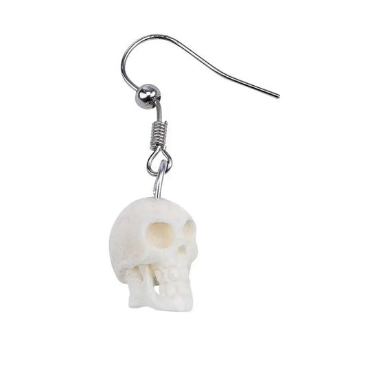 Skull-shaped earring on a white background