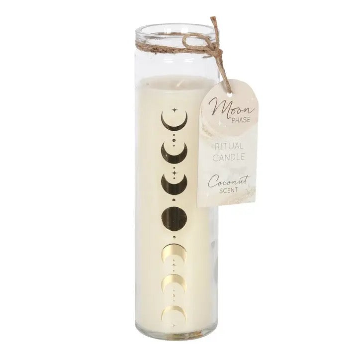 A tall glass jar candle with a wax fill and moon phase graphic printed on the side, tied with twine and featuring a hanging tag that reads 'Moon Phase Ritual Candle Coconut Scents'.