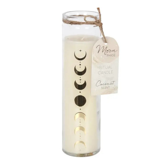 A tall glass jar candle with a wax fill and moon phase graphic printed on the side, tied with twine and featuring a hanging tag that reads 'Moon Phase Ritual Candle Coconut Scents'.