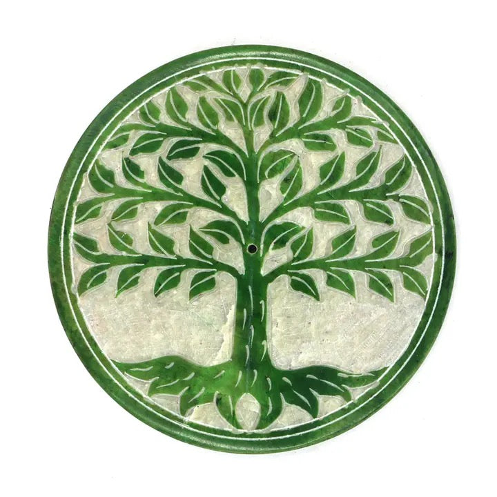 Decorative incense holder with a green tree design on a white background