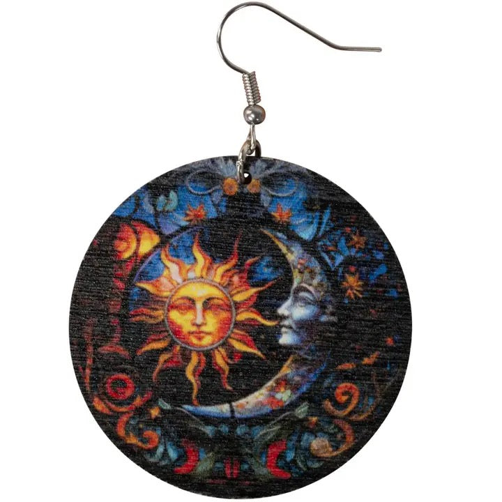 Earrings with sun and moon design on a black background
