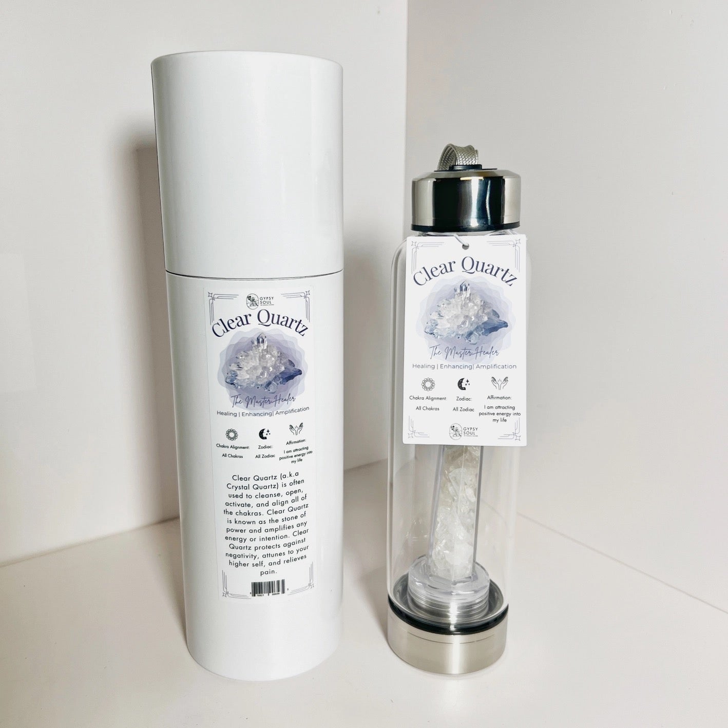 Clear Quartz crystal water bottle with packaging on a white background