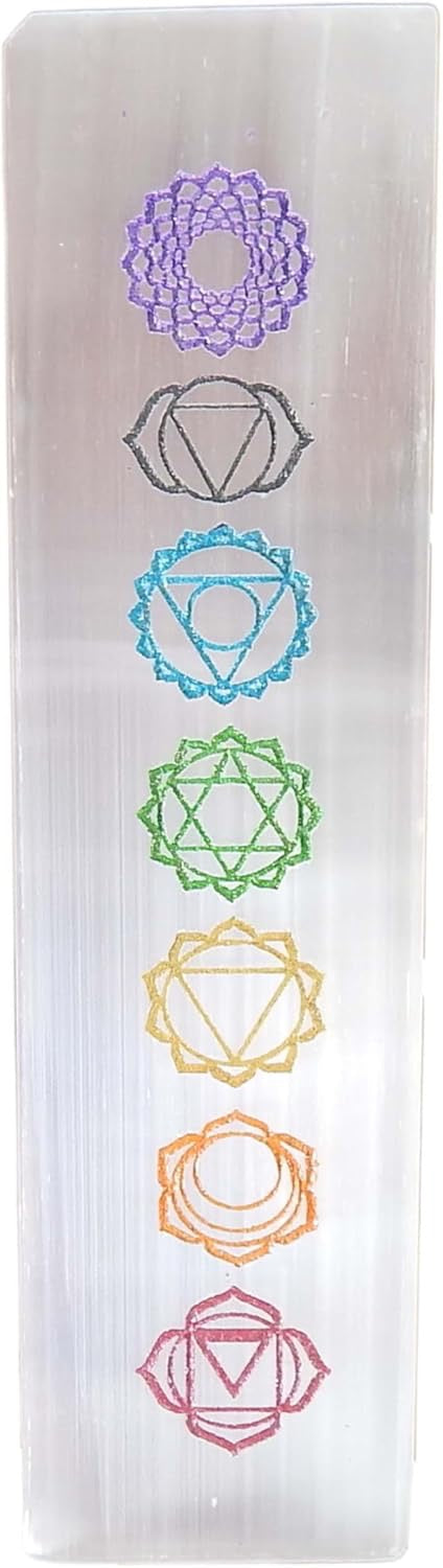 Selenite crystal with chakra symbols on a white background