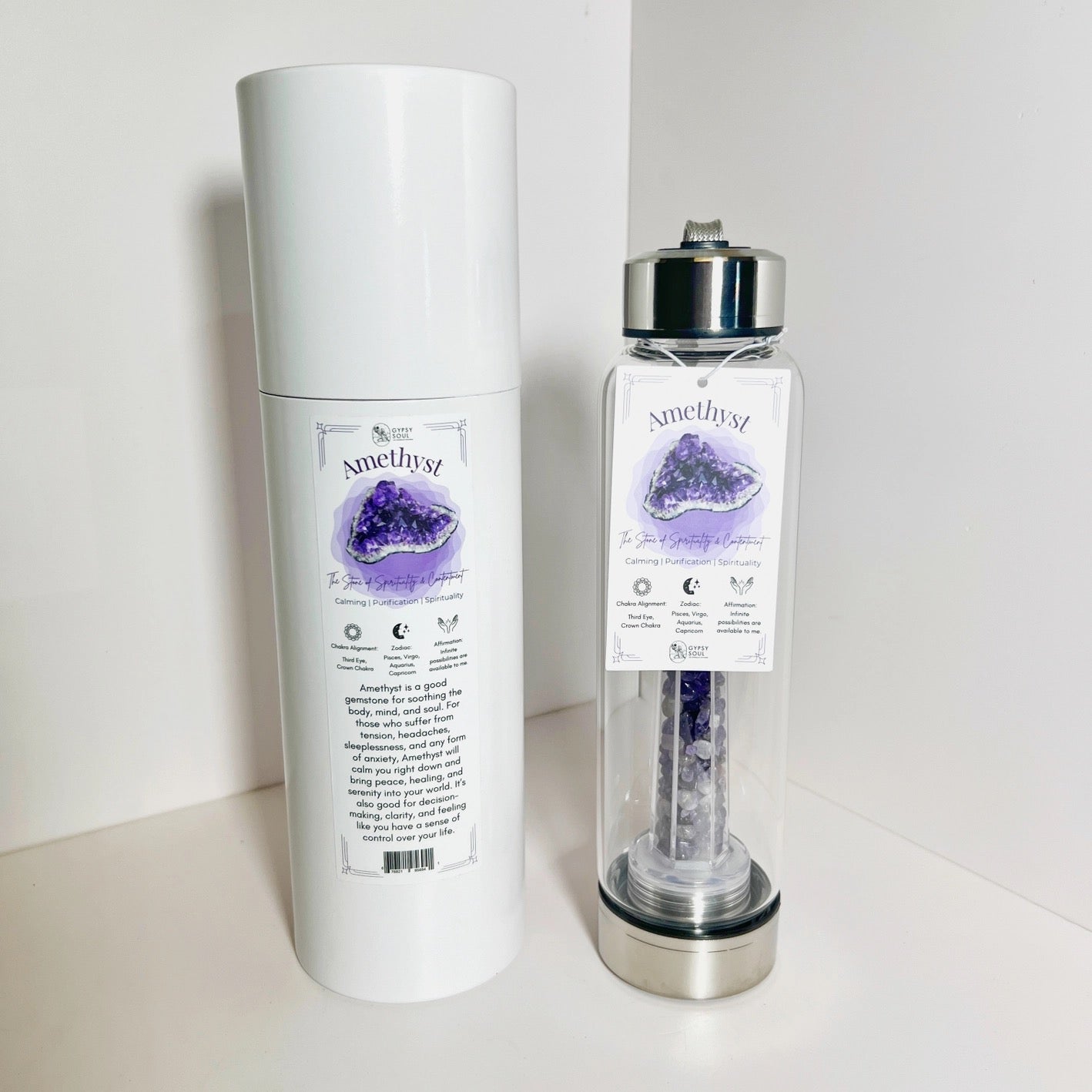 Amethyst crystal water bottle with packaging on a white background
