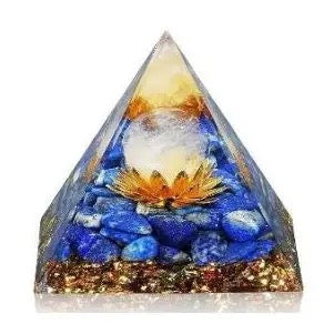 Pyramid-shaped decorative item with blue stones and a glowing center on a white background