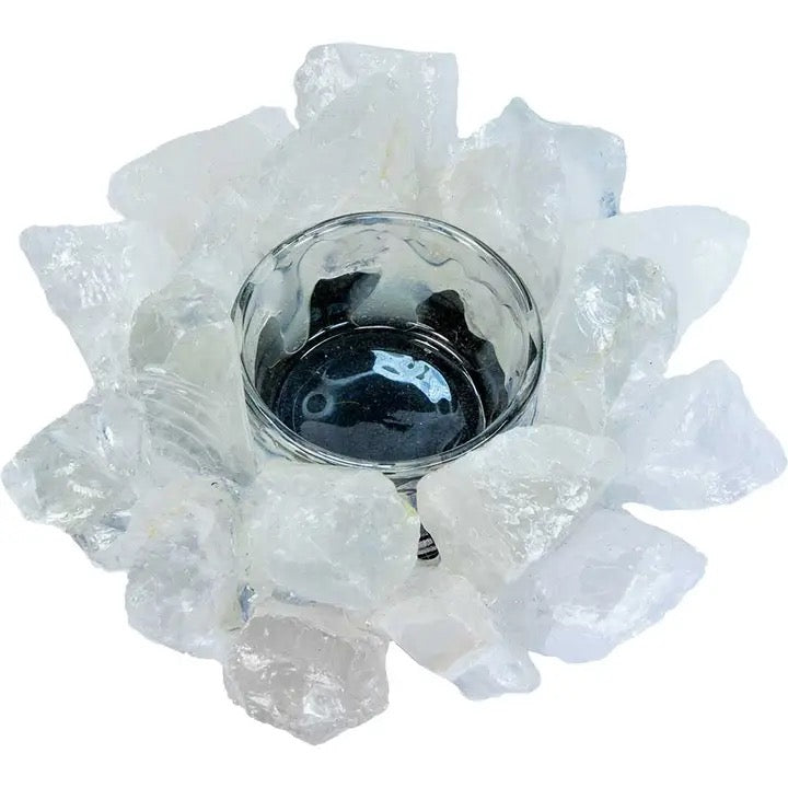 Decorative candle holder made of clear crystals on a white background