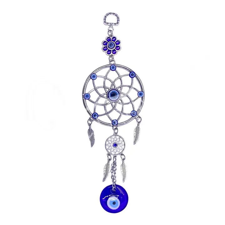 Decorative dreamcatcher with blue evil eye charm on a white background