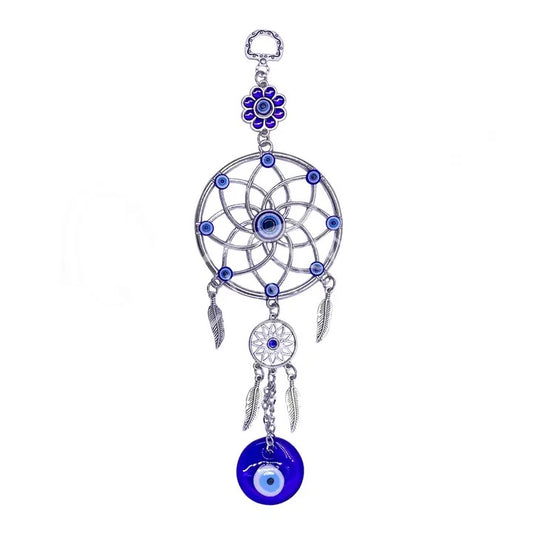 Decorative dreamcatcher with blue evil eye charm on a white background
