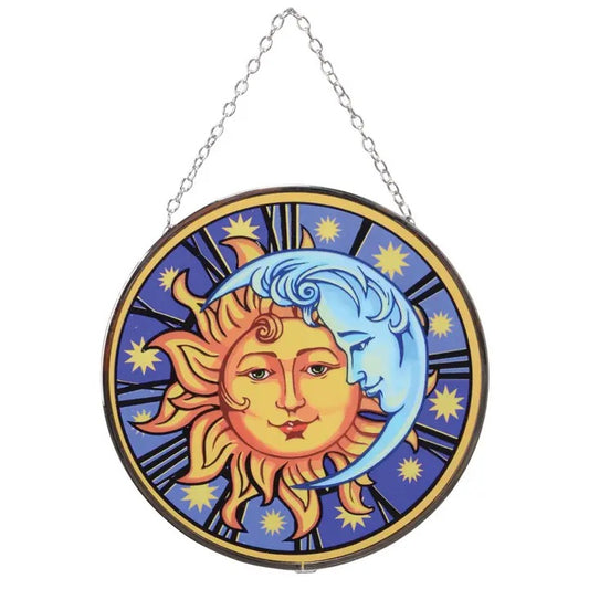 Decorative wall hanging with sun and moon design on a white background