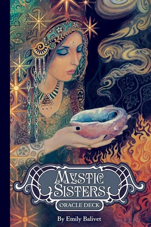 Book cover of 'Mystic Sisters Oracle Deck' featuring an illustration of a woman with a crystal ball against a mystical background.