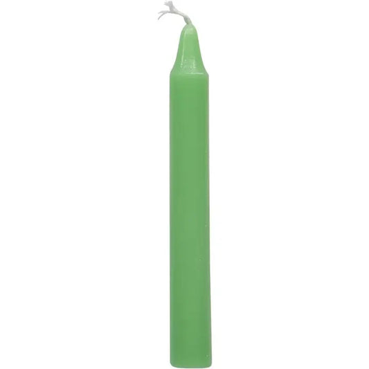 Green candle on a white background