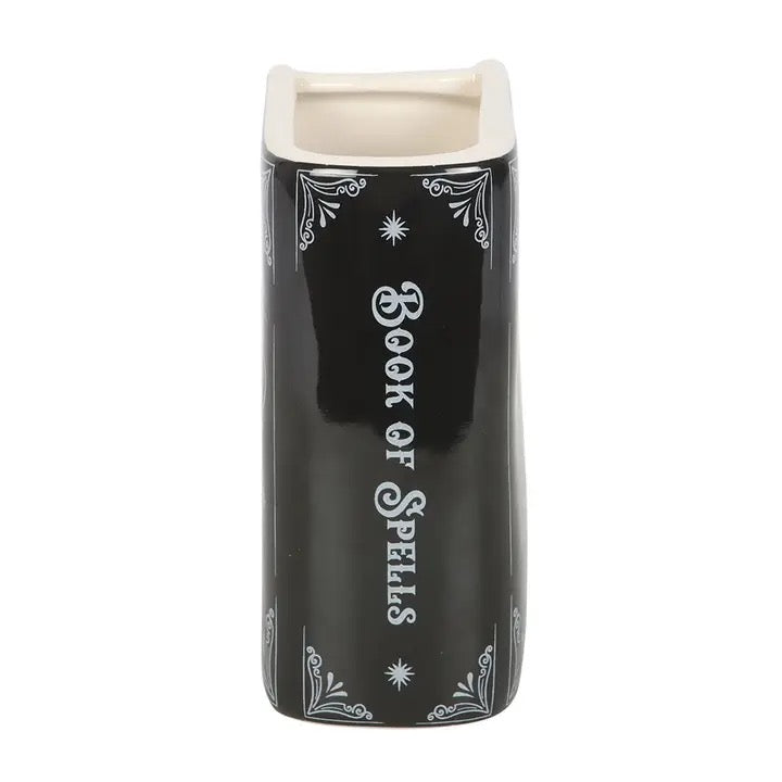 Black container with 'Book of Spells' text on a white background