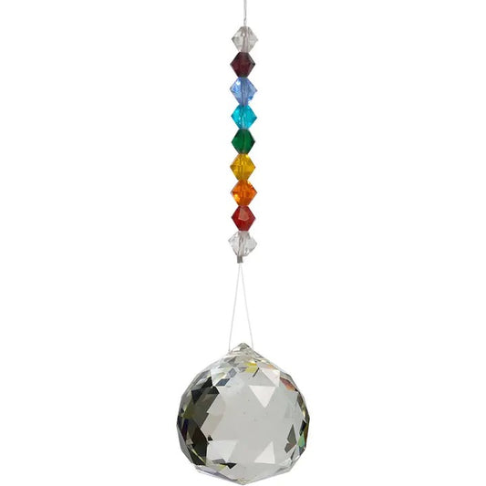 Crystal ball with colorful beads on a white background
