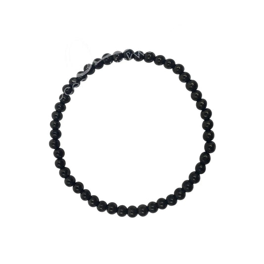 Black beaded bracelet on a white background