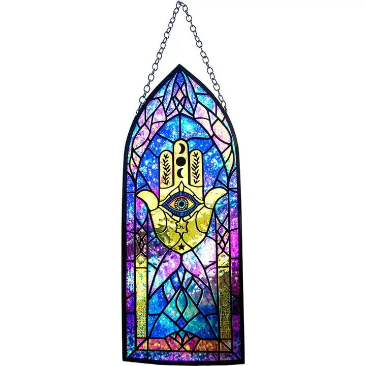 Stained glass window hanging with Hamsa design on a white background