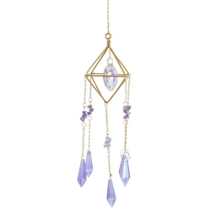 Decorative hanging crystal with gold frame and purple stones on a white background