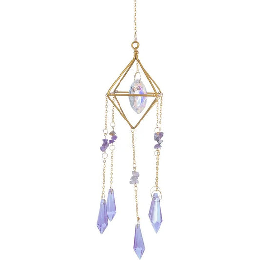 Decorative hanging crystal with gold frame and purple stones on a white background